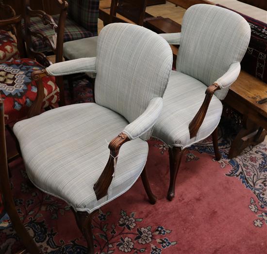 A pair of French walnut fauteuils